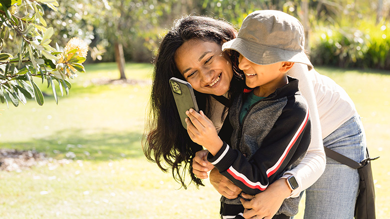 Woman and child using a smartphone