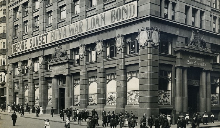CBA building with war bond advertising
