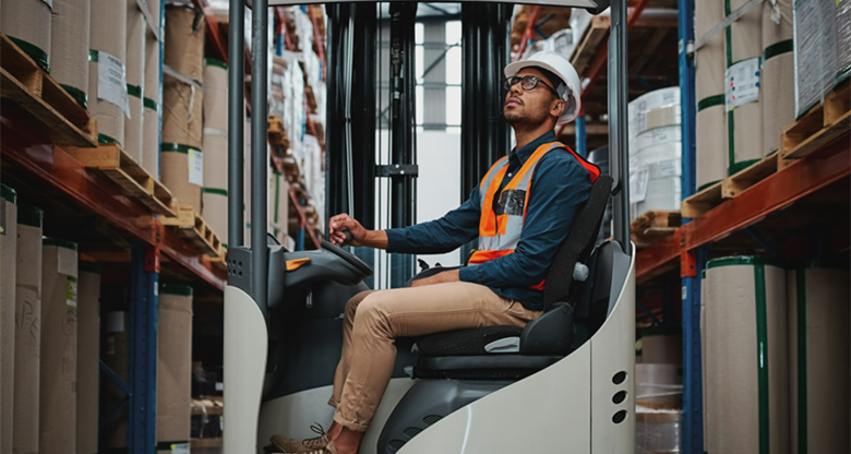 Image of a man on a forklift in a warehouse