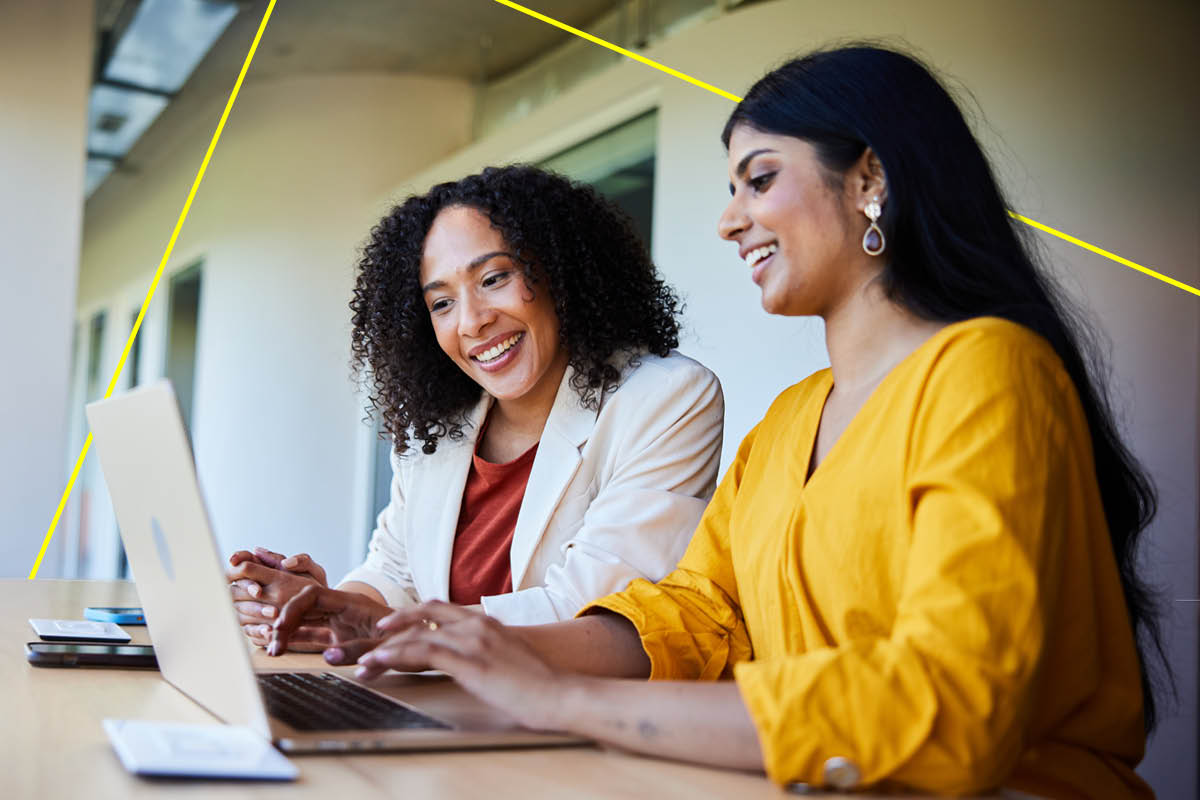 Regional landscape with rolling grass hills, a small lake, trees and a clear sky