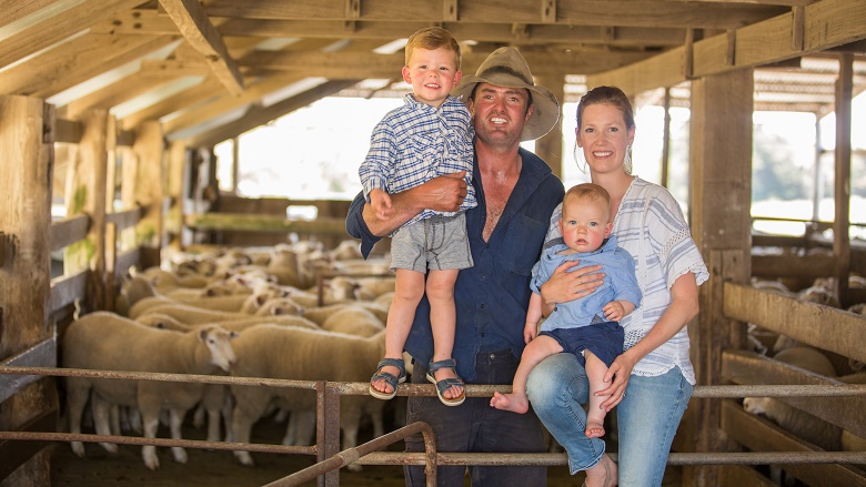 Ellis family standing in barn