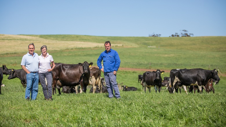 Dairy farmers in field