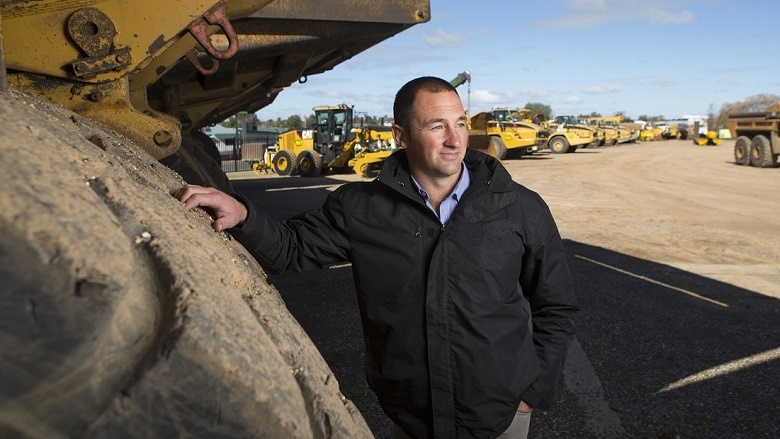 Man next to tractor