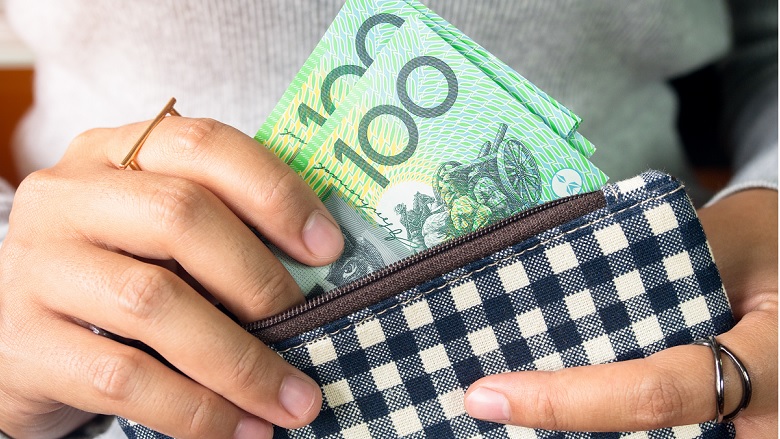 Cash going into wallet
