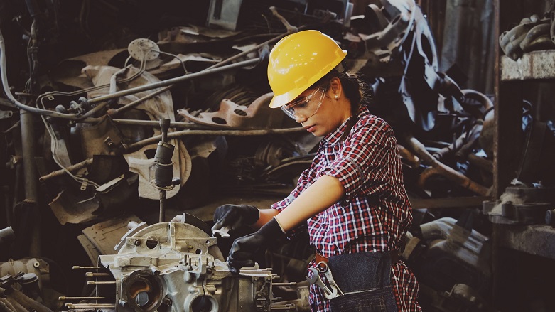 Female using electric saw