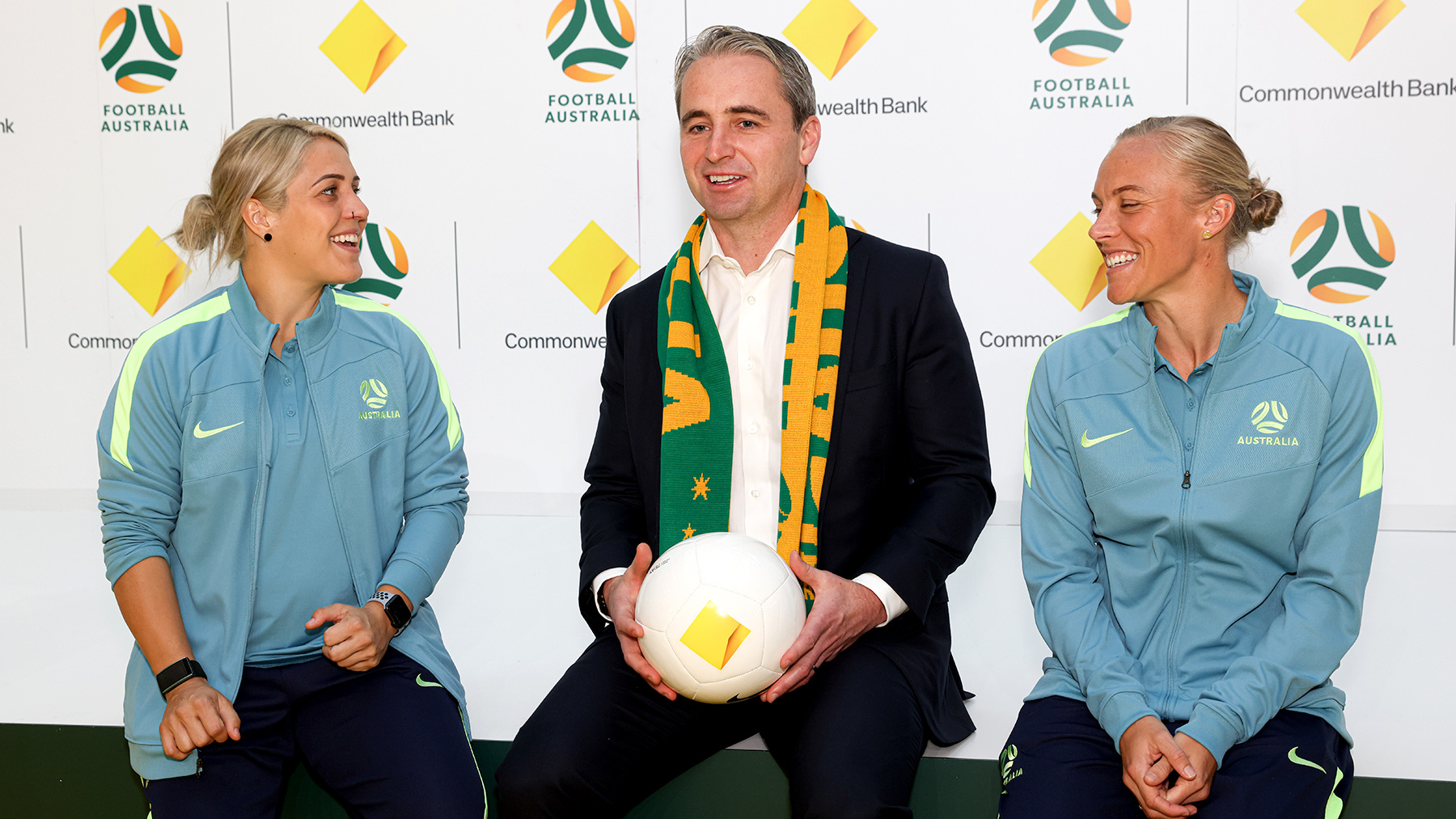 Matt Comyn with Matildas players