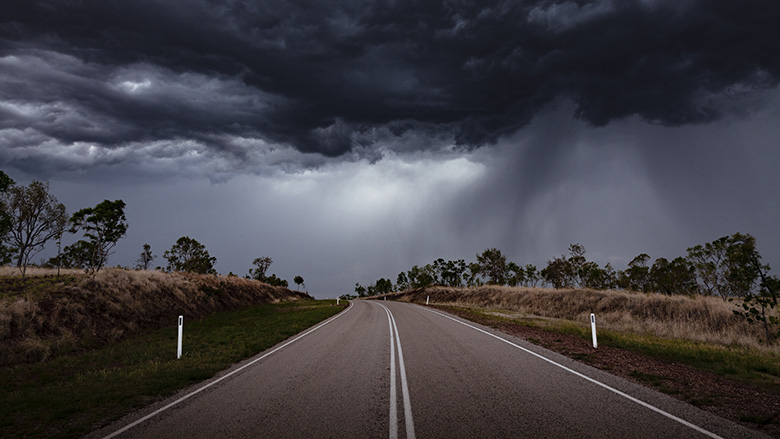 A road with storm clouds