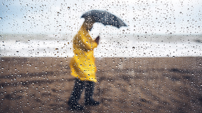 Woman sheltering from a storm