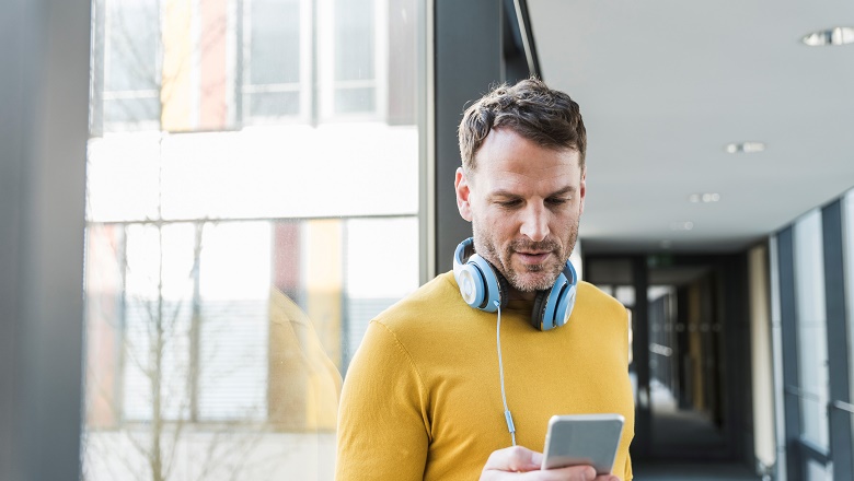 Man looks at phone