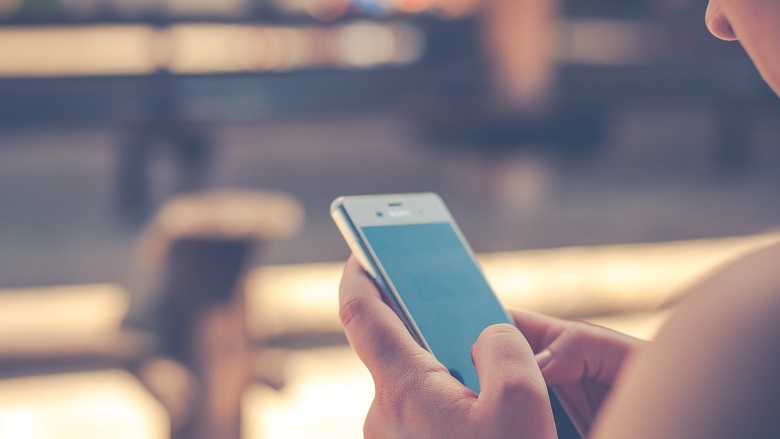 woman holding phone