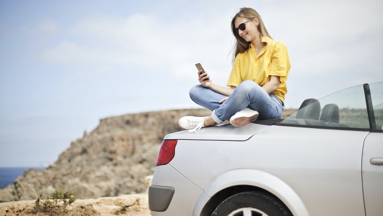 Woman on car