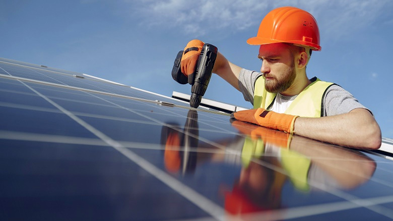 Man installing solar panels