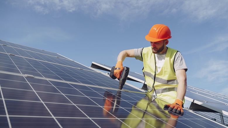 Man installing solar panels