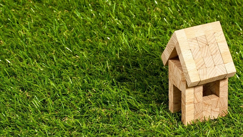 house made of toy blocks on the grass