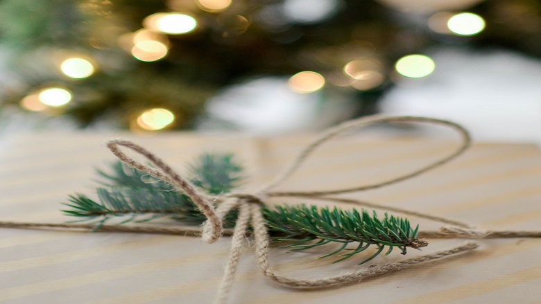 Present in front of the Christmas tree