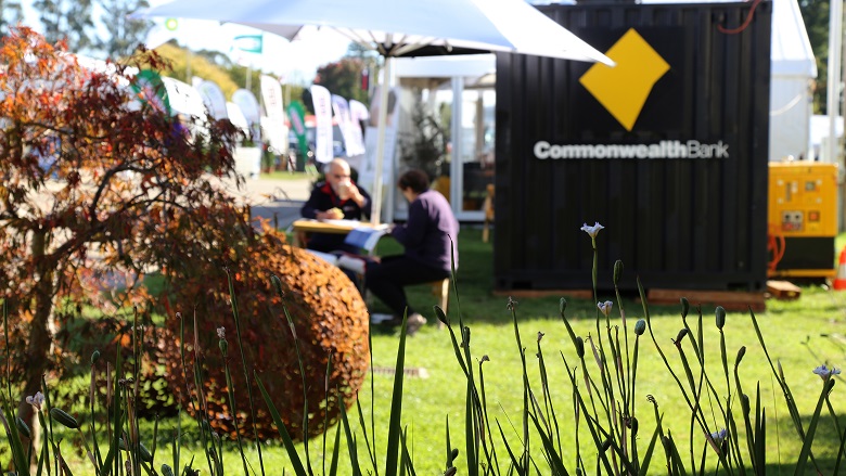 Pair having a coffee break during Farm World fare