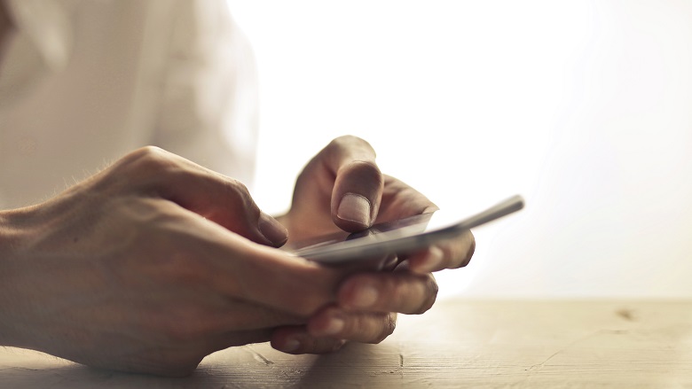 A person looking at a phone. 