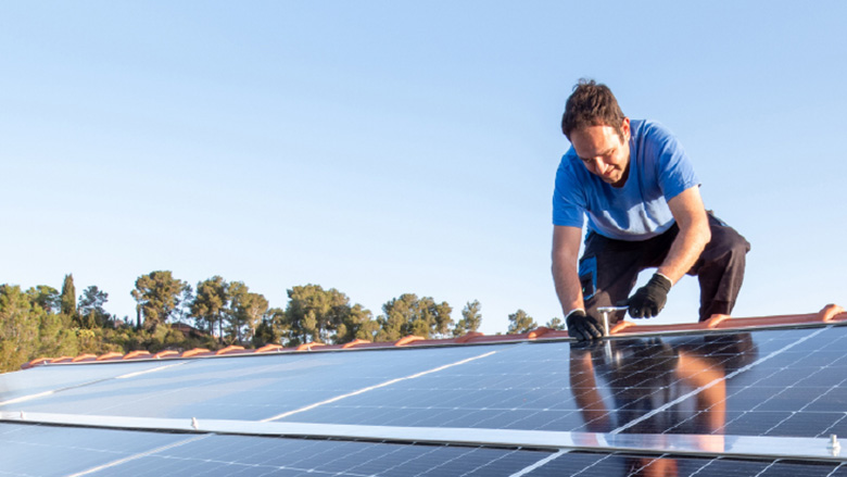 Man installing solar panels