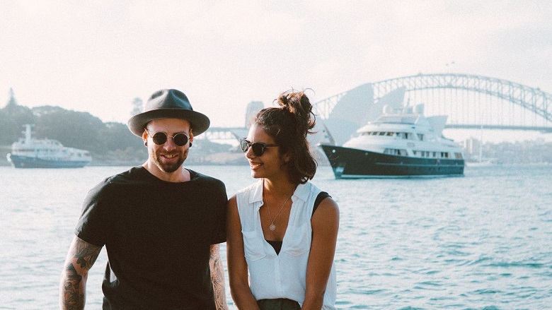 couple in front of Sydney harbour and bridge