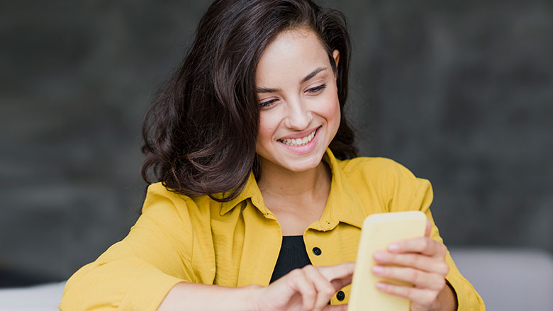 woman in dark with phone