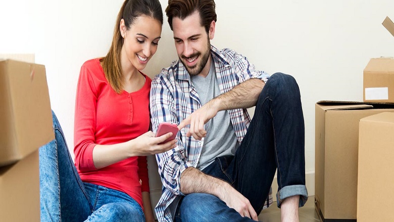 couple using mobile for saving