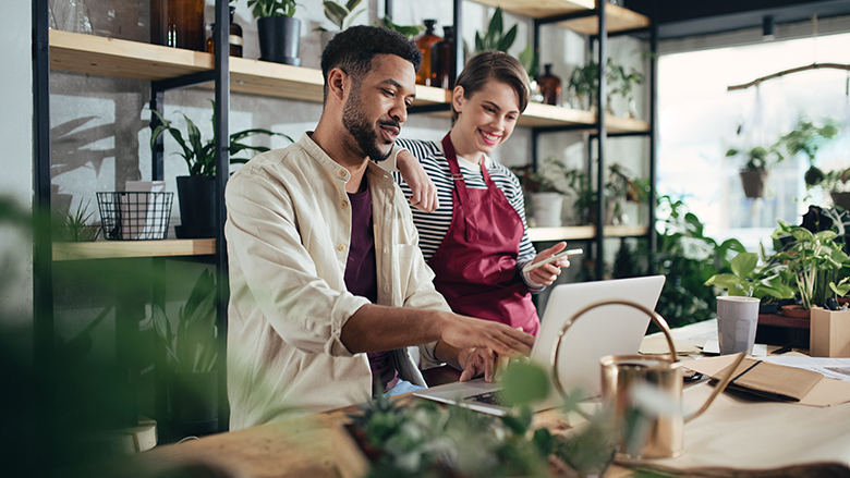 Small business owners using a computer