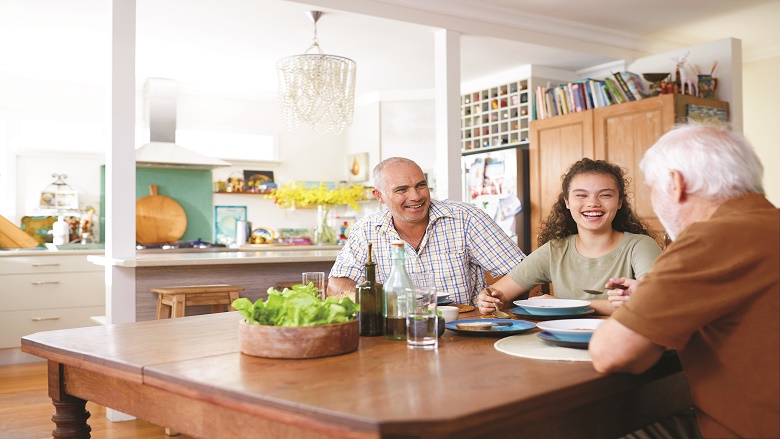 Family talking at the kitchen table