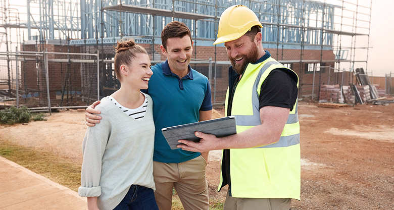 young couple and builder