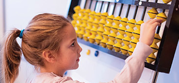 Child using an abacus
