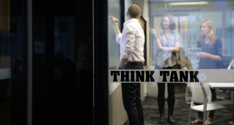 CommBank co-workers working at whiteboard