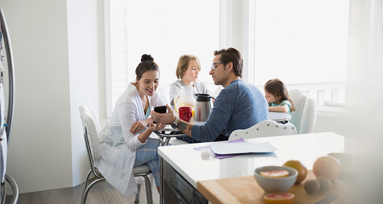 Young family at breakfast table