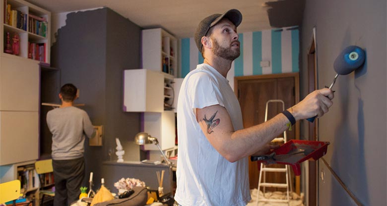 Homeowners painting their investment apartment