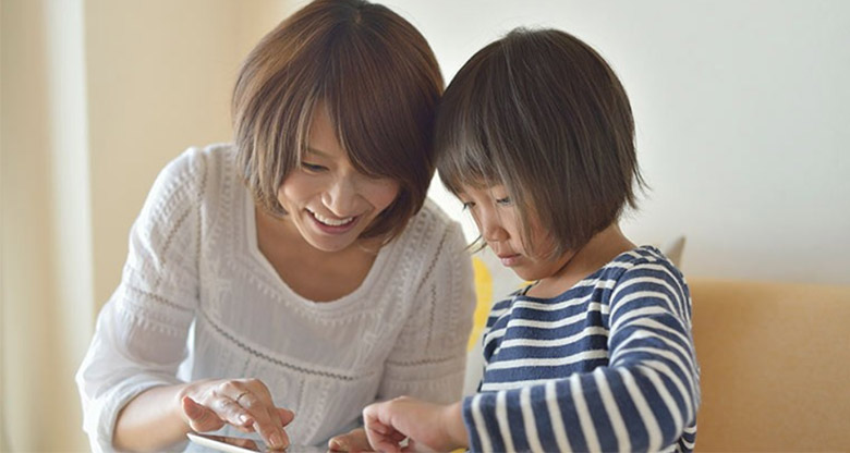 Mother and daughter on an iPad