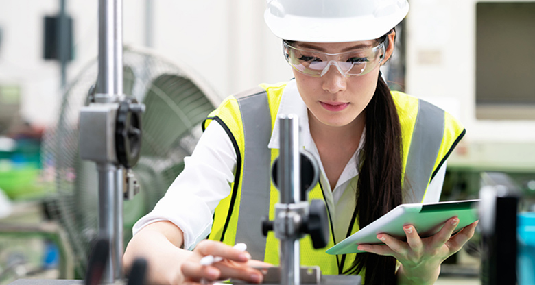 Young Asian woman working in a manufacturing plant