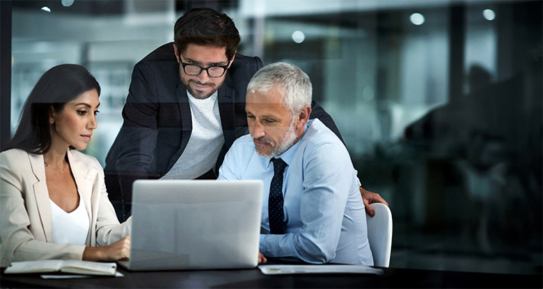 Business people around a computer