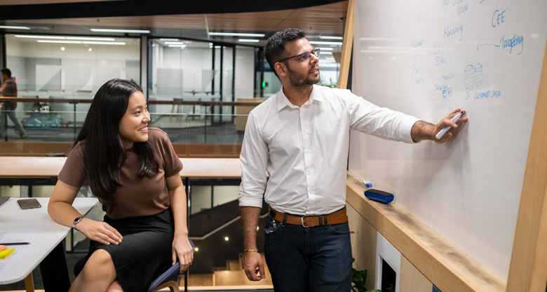 CBA engineers at a whiteboard