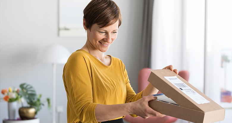 woman opening package