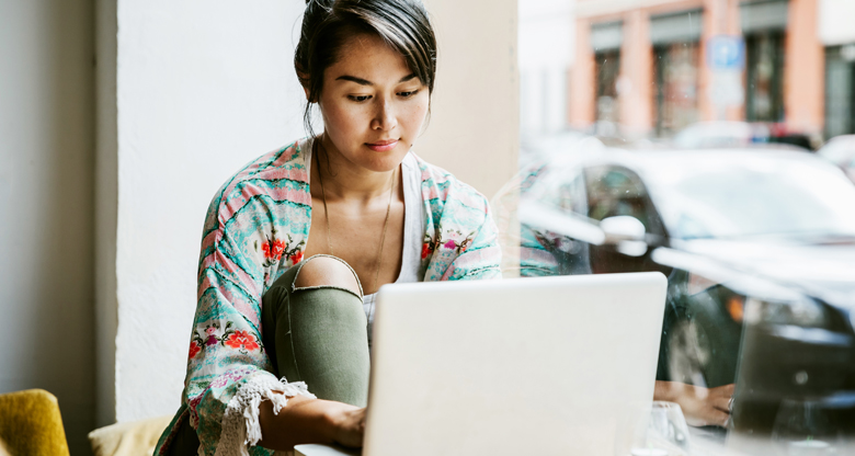 woman sitting at her laptop