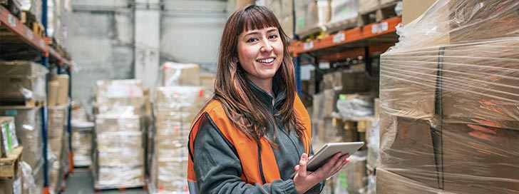 Woman checking inventory in warehouse