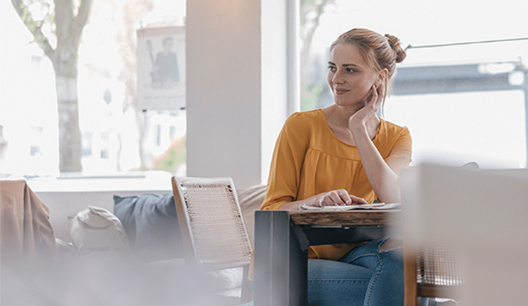 woman at desk looking to left