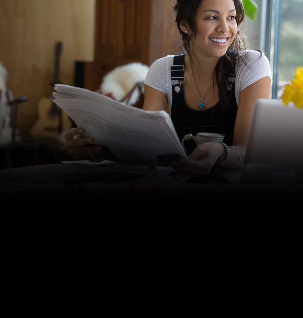 Young woman reading her newspaper