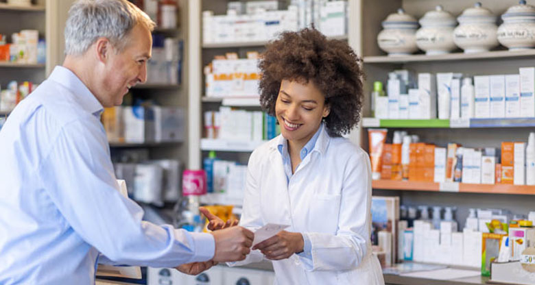 Pharmacist serving a patient