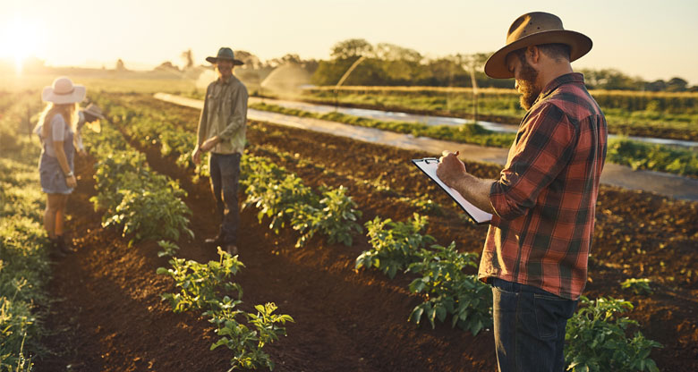 Image of a farmer wearing a hat on a farm