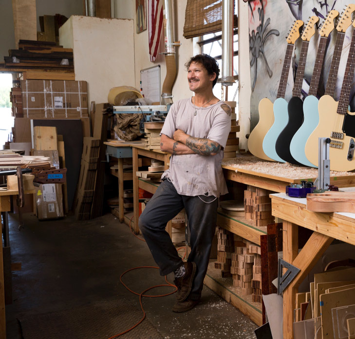man in guitar factory