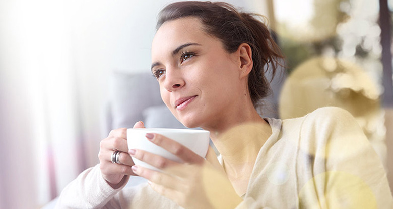 woman holding coffee mug