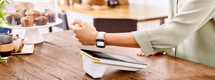 Customer paying with her Apple smart watch