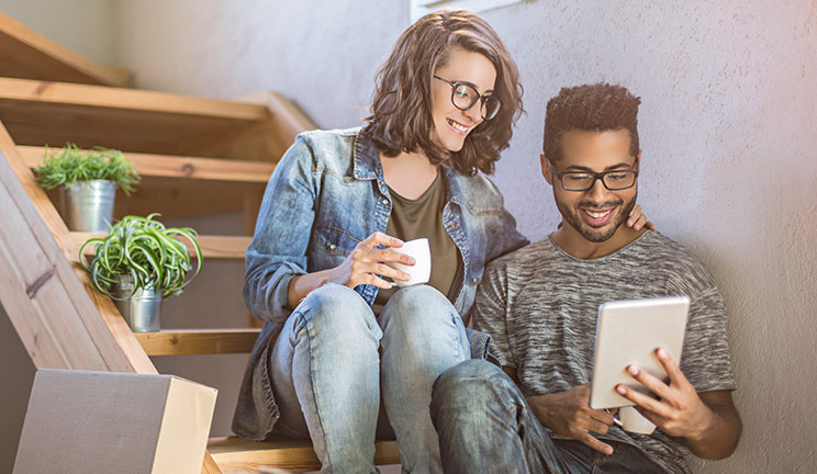 Couple looking at tablet device