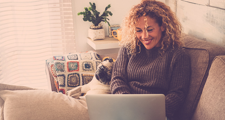 Woman on couch with laptop