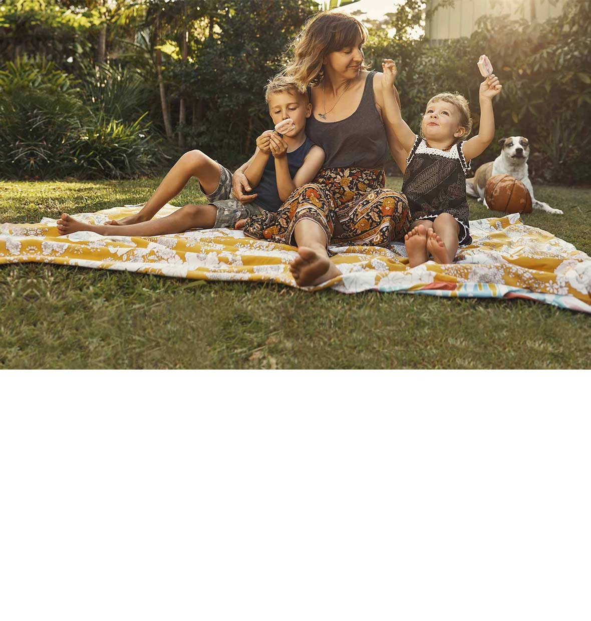 mother with two children in backyard