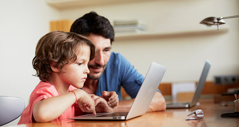Parent and child with laptop